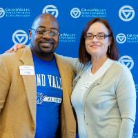 two panelists pose for a picture